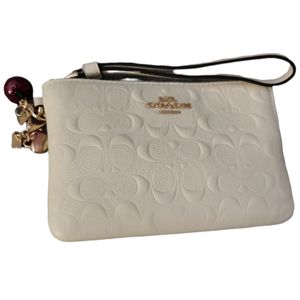 Coach Wristlet with heart and apple charms
